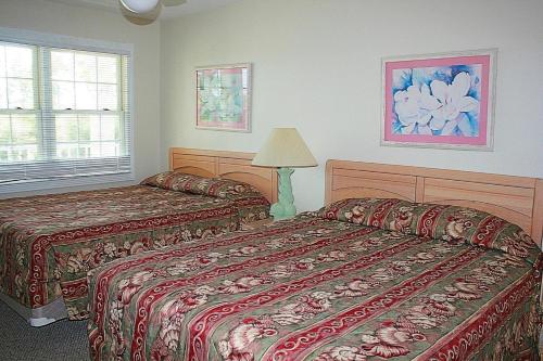 Krevet ili kreveti u jedinici u objektu Brunswick Plantation Villa 1 #311M Villa