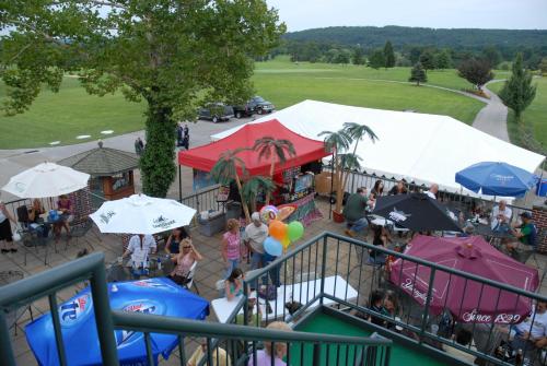 an overhead view of a market with tents and umbrellas at Bridges Guest Quarters in Abbottstown