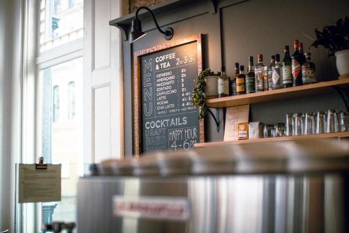 a chalkboard sign on the wall of a restaurant at The Society Hotel in Portland