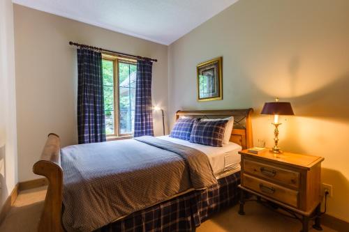 Cama o camas de una habitación en L'Équinoxe Rendez-Vous Mont-Tremblant