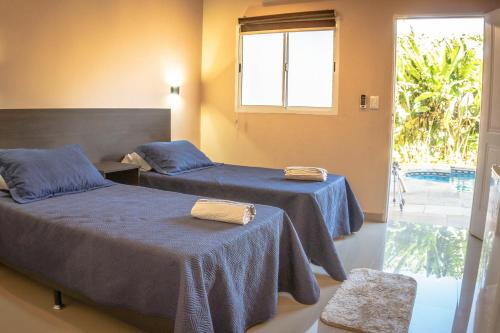 Säng eller sängar i ett rum på Managua Apart Hotel
