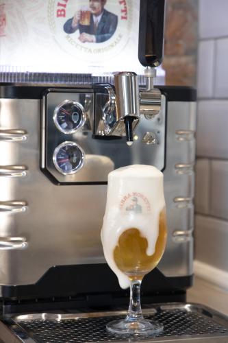 a glass of beer in front of a coffee machine at York Street Studios in Liverpool