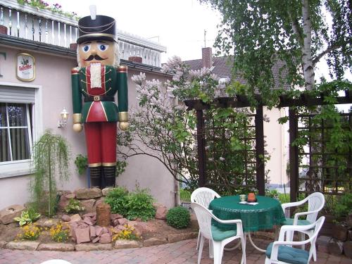 a large statue of a nutcracker in a garden at Hotel Nußknacker in Fulda