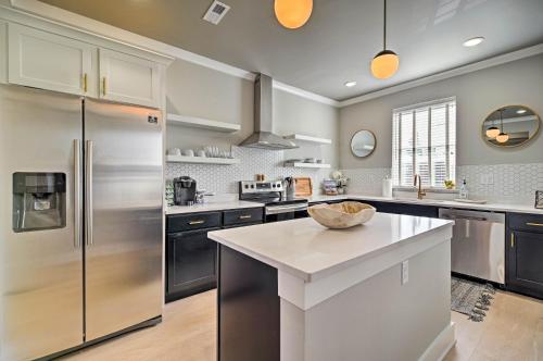 a kitchen with a stainless steel refrigerator and a counter at Downtown Modern Luxury - Great location in Chattanooga