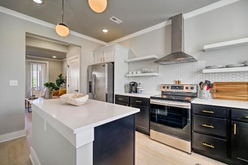 a large kitchen with a white counter top and appliances at Downtown Modern Luxury - Great location in Chattanooga
