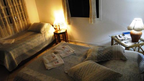 Una cama o camas en una habitación de Pousada Chez Nice