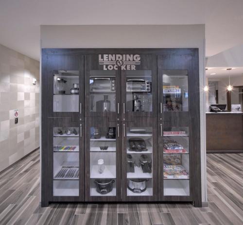 a store with glass doors and shelves with food at Candlewood Suites Baltimore - Inner Harbor by IHG in Baltimore
