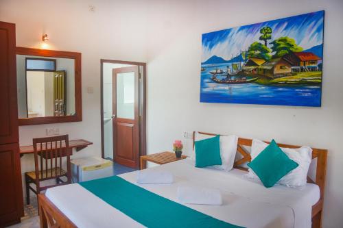 Katil atau katil-katil dalam bilik di Di Sicuro Tourist Inn