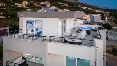 an aerial view of a house with a balcony at Villa Palladium in Makarska