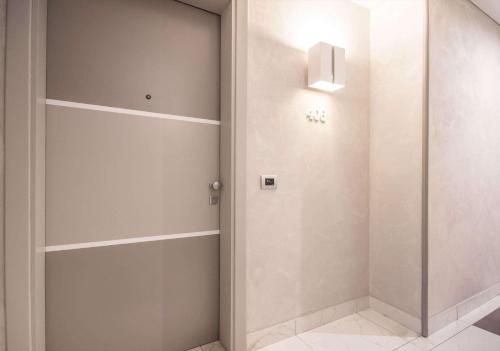 a walk in closet with a glass door at Best Western Modena District in Campogalliano