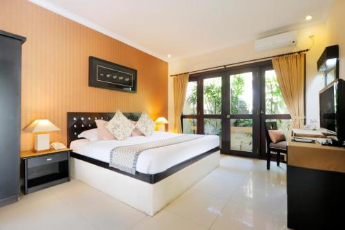 Cama o camas de una habitación en Heliconia Villa