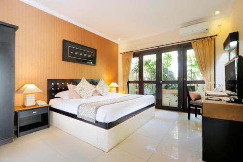 Ένα ή περισσότερα κρεβάτια σε δωμάτιο στο Heliconia Villa