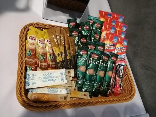 a basket filled with different types of food and drinks at Lampang Residence in Lampang
