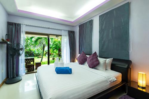 Säng eller sängar i ett rum på Phangan Beach Resort