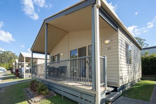a house with a large porch on the side of it at Ingenia Holidays Noosa in Tewantin