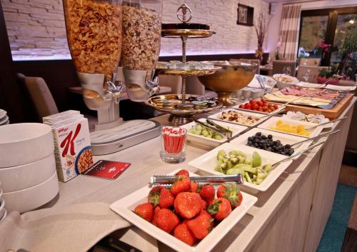 a buffet line with a lot of food on it at Hotel Val de l'Our in Burg-Reuland
