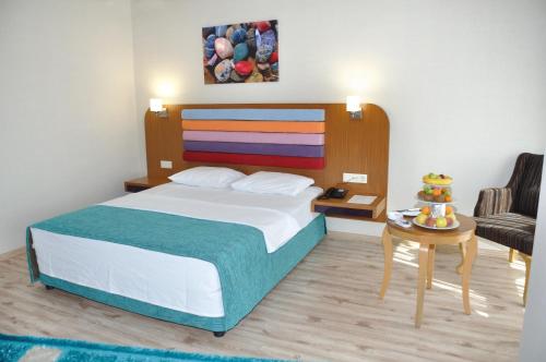 Ένα ή περισσότερα κρεβάτια σε δωμάτιο στο Hanem Hotel