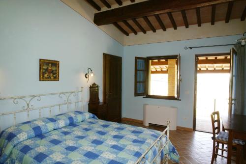 Ένα ή περισσότερα κρεβάτια σε δωμάτιο στο Agriturismo Vergelle
