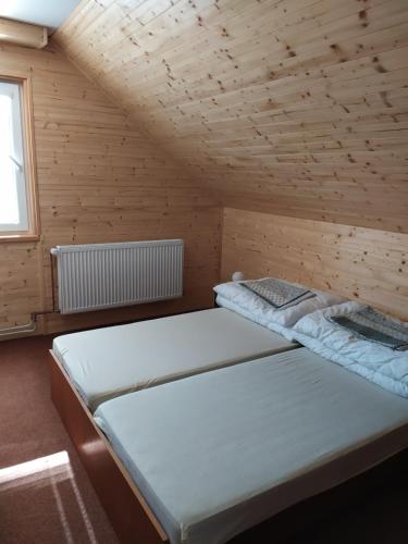 Postel nebo postele na pokoji v ubytování Apartmany Bobule