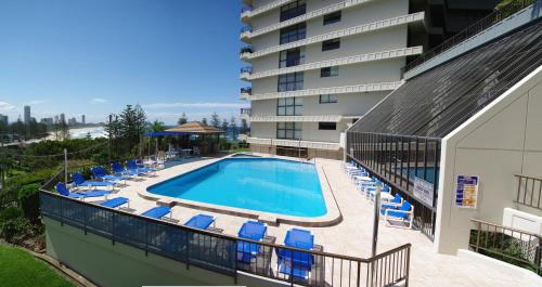 a hotel room with a large swimming pool at Gemini Court Holiday Apartments in Gold Coast