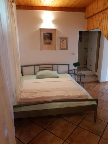 a bedroom with a bed in a room at Apartment Dubrava in Dubrovnik