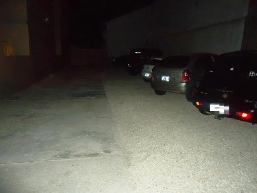 two cars parked in a garage at night at Ayres Sur in Mar del Plata