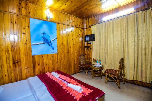 TV a/nebo společenská místnost v ubytování Aranya Jungle Resorts
