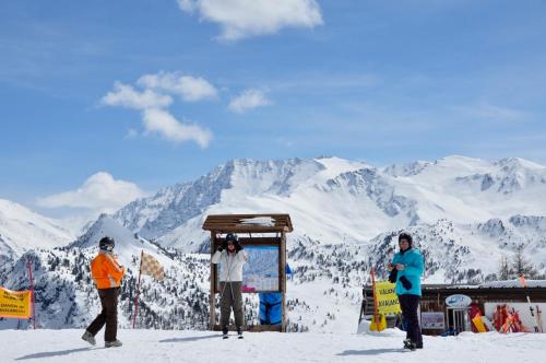 a group of people standing on top of a snow covered mountain at Il Fraitevino hotel bed & breakfast in Sestriere