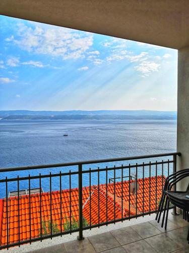 a view of the ocean from a balcony at Apartments Nostro in Omiš
