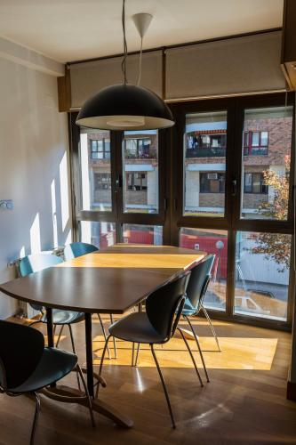 a dining room with a table and chairs at Bidasoa by Basquelidays in Irún