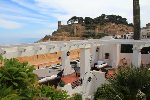 a view of a building with a view of the ocean at Hotel Diana in Tossa de Mar