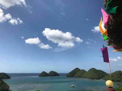 a view of the ocean with islands in the background at C View Resort in Sipalay