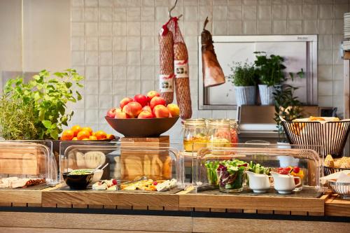 a kitchen counter with a bunch of fruits and vegetables at Hotel Bellotto in Warsaw