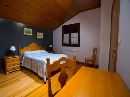 Tempat tidur dalam kamar di Casa Rural Olazi