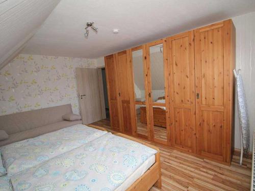 Postel nebo postele na pokoji v ubytování Ferienwohnung am Kaiserwald, 15191