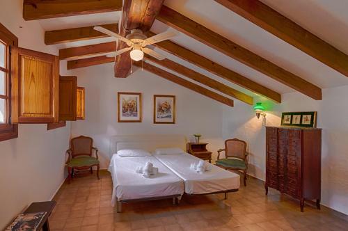 En eller flere senge i et værelse på Villas Guzman - Andurina