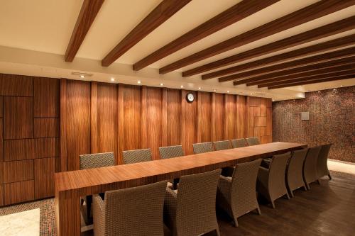 a conference room with a long table and chairs at Tallink Hotel Riga in Rīga