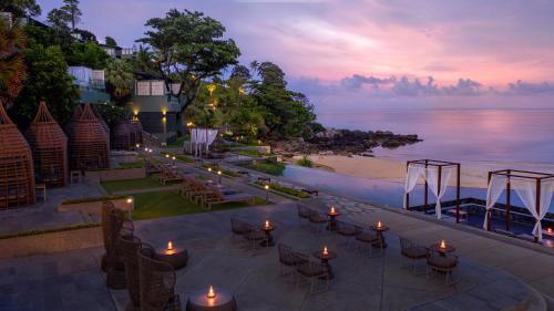 a wedding reception on the beach at dusk at The Shore At Katathani - Adult Only - SHA Extra Plus in Kata Beach