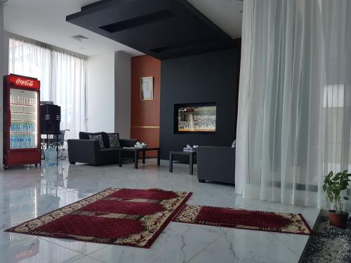 a living room with couches at Magic suite sabah Alsalem in Kuwait
