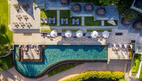 an aerial view of a resort with a swimming pool at The Shore At Katathani - Adult Only - SHA Extra Plus in Kata Beach