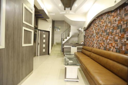 a hallway with stairs and a brick wall at Malhotra Guest House 50 Meter from Golden Temple in Amritsar