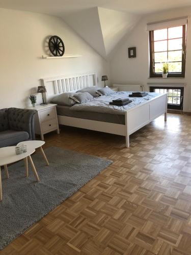 a bedroom with a bed and a living room at Altstadt Quartier Hameln in Hameln