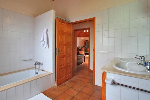 a bathroom with a tub and a sink at Casa Amalia in Los Llanos de Aridane