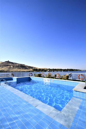 a swimming pool on a cruise ship with the ocean at JAZ Crown Empress Nile Cruise - Every Monday from Luxor for 07 & 04 Nights - Every Friday From Aswan for 03 Nights in Luxor