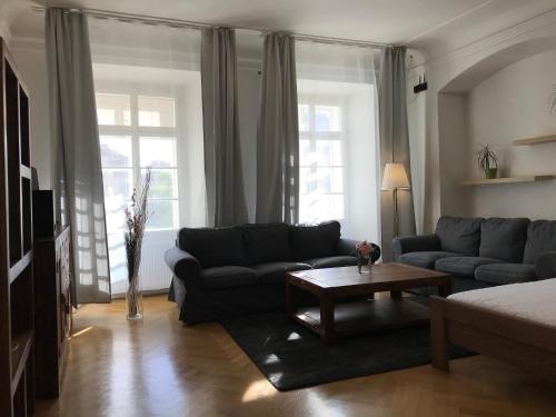 A seating area at Charles Bridge Apartments