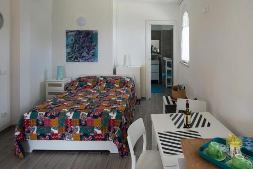 Ένα ή περισσότερα κρεβάτια σε δωμάτιο στο L' Aia di Carinda R.T.A.