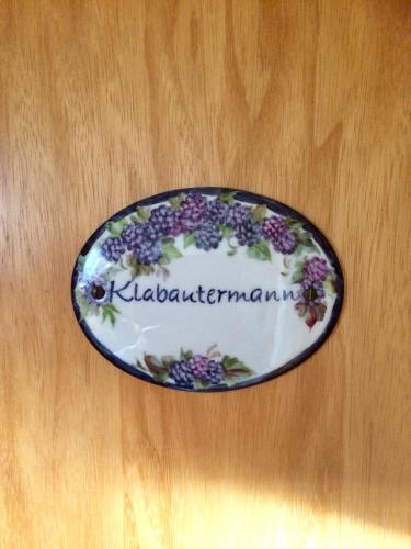 a plate with flowers on it sitting on a table at Hus Nordhauk in Borkum