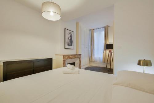 Ένα ή περισσότερα κρεβάτια σε δωμάτιο στο Le superbe des Dominicains