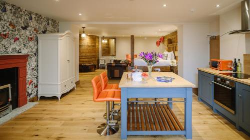 a kitchen filled with furniture and a table at Grange Boutique Hotel in Grange Over Sands
