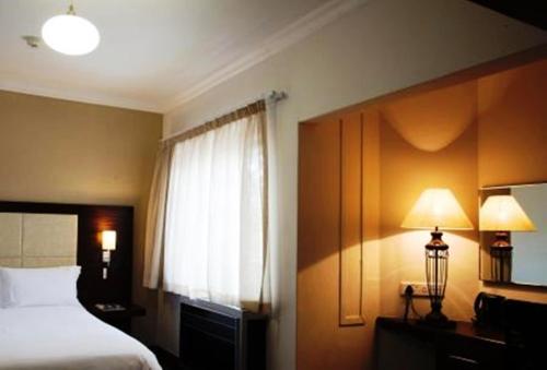 Letto o letti in una camera di Premier Splendid Inn Pinetown